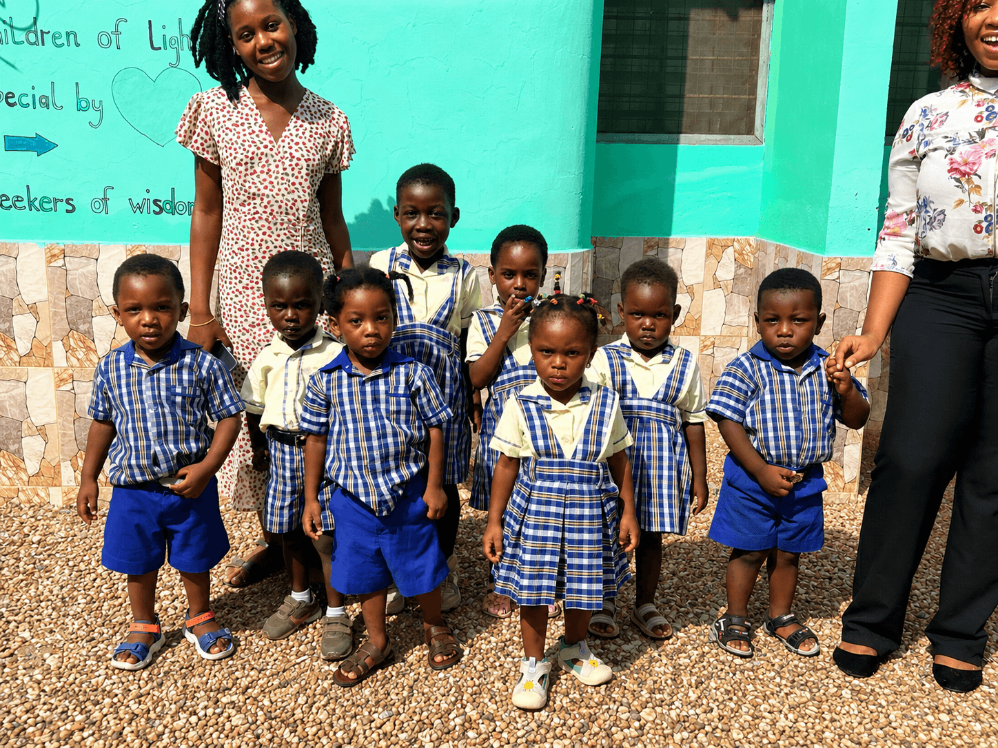 Children in Enclave of Wisdom Montessori uniforms